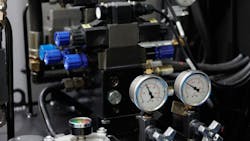 Hydraulic components, including pressure gauges, on industrial machinery Hydraulic components, including pressure gauges, on industrial machinery