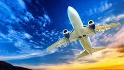 Underside view of an airplane flying in the sky Underside view of an airplane flying in the sky