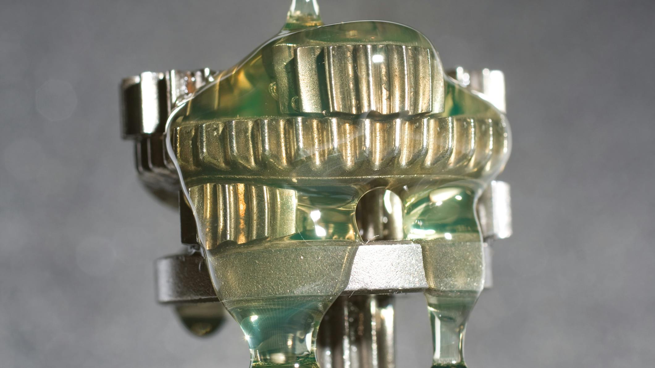 Lubricant Being Poured onto a Gear