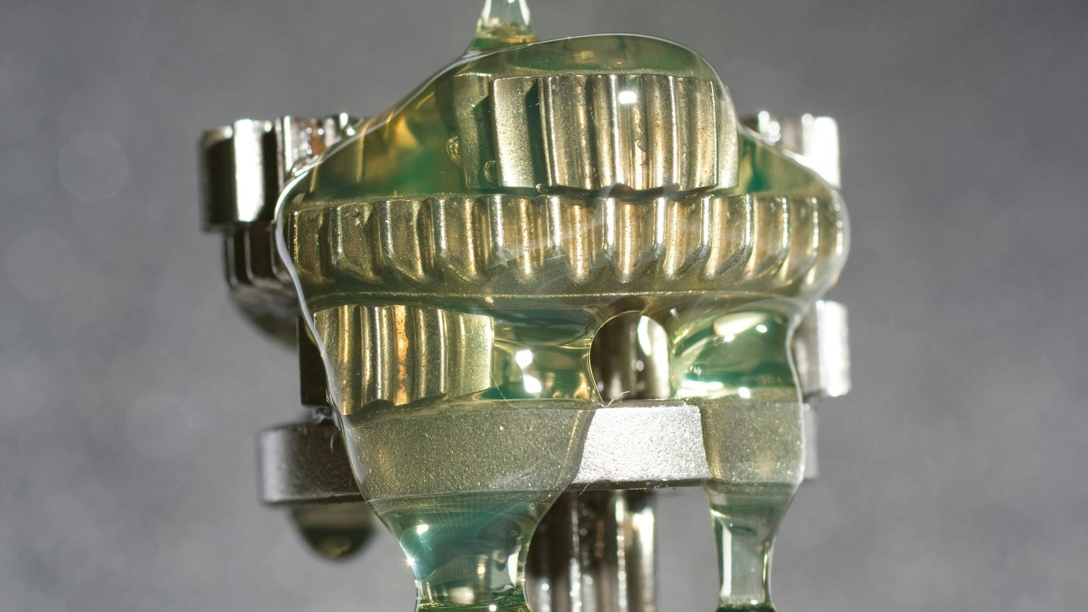 Lubricant Being Poured onto a Gear