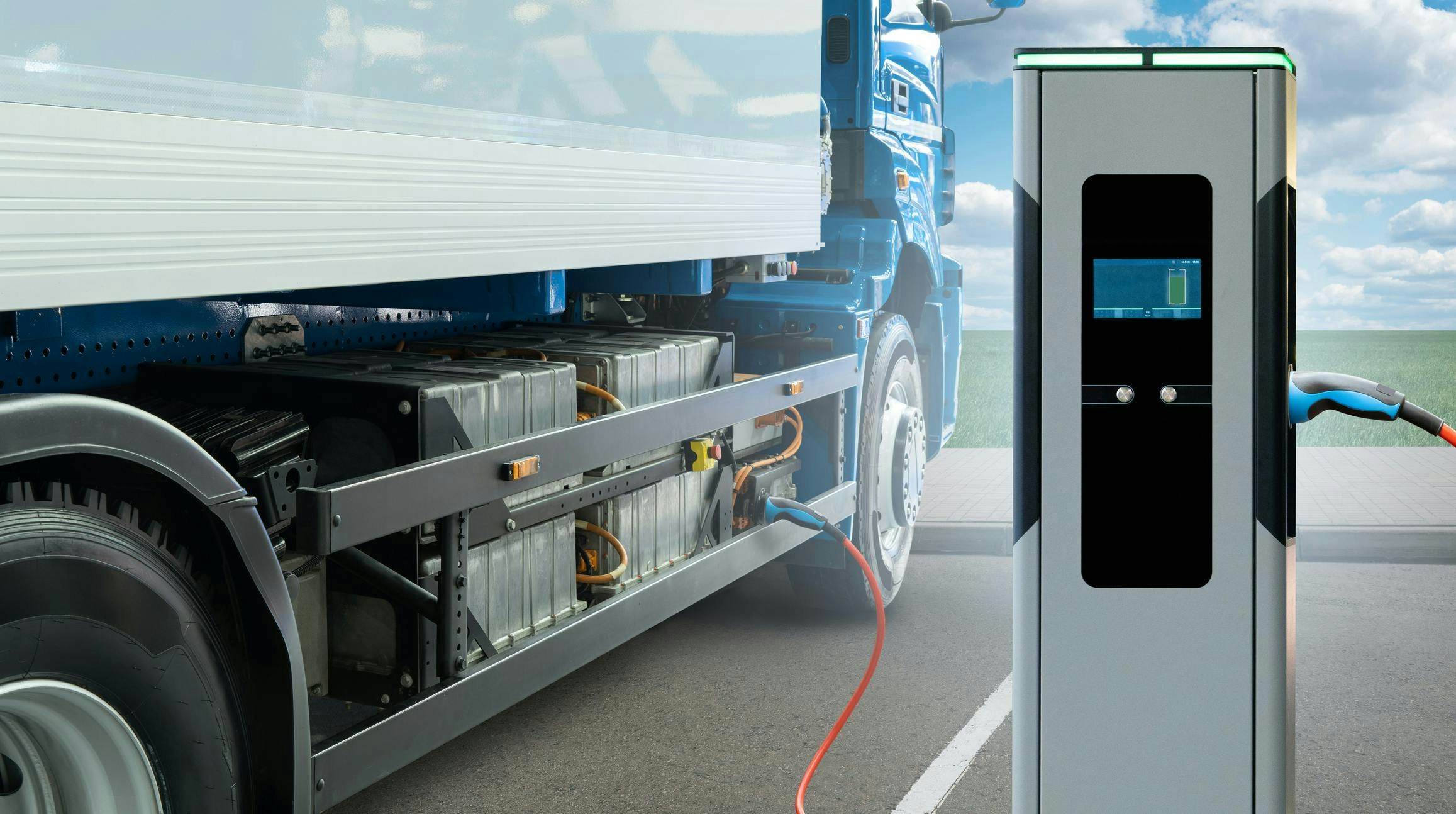 Concept of Heavy-Duty Electric Truck Next to Charger