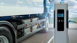 Concept of Heavy-Duty Electric Truck Next to Charger Concept of Heavy-Duty Electric Truck Next to Charger