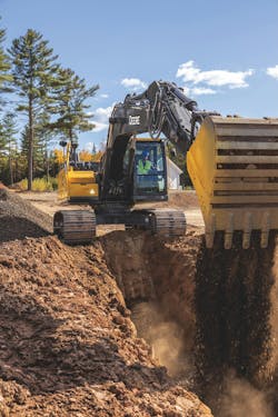 John Deere 230 P-Tier Excavator Doing Grading Work John Deere 230 P-Tier Excavator Doing Grading Work