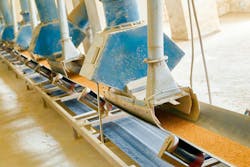 Grain moving through a Conveyor System in Grain Handling Facility Grain moving through a Conveyor System in Grain Handling Facility