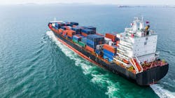 Aerial view of a cargo ship sailing through open waters Aerial view of a cargo ship sailing through open waters
