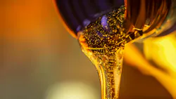 Oil Being Poured from a Bottle Oil Being Poured from a Bottle