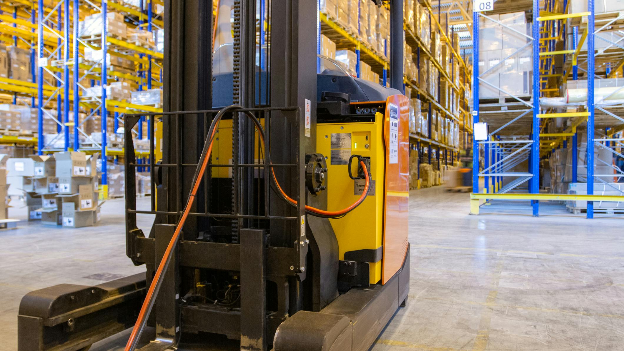 Electric Forklift Connected with Charging Cable Connected to it