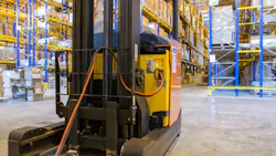 Electric Forklift Connected with Charging Cable Connected to it Electric Forklift Connected with Charging Cable Connected to it