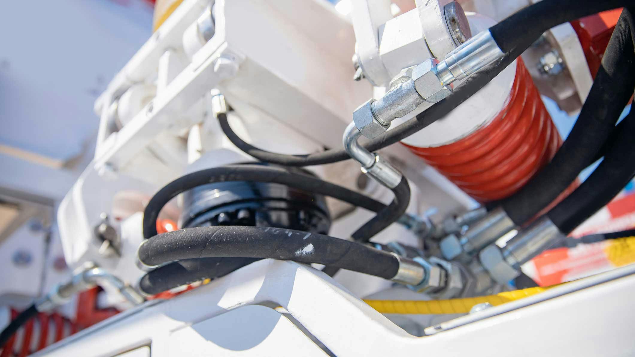Close up view of Hydraulic Hoses and Other Components on a Machine