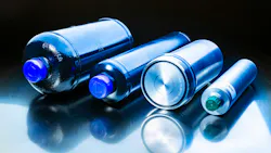 Several piston accumulators from Freudenberg Sealing Technologies on a blue background Several piston accumulators from Freudenberg Sealing Technologies on a blue background
