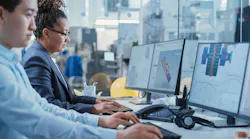 Two engineers working on computers