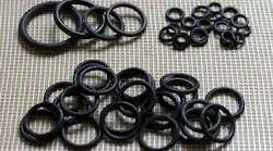 Several rubber seals laid out on a surface Several rubber seals laid out on a surface