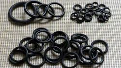 Several rubber seals laid out on a surface Several rubber seals laid out on a surface