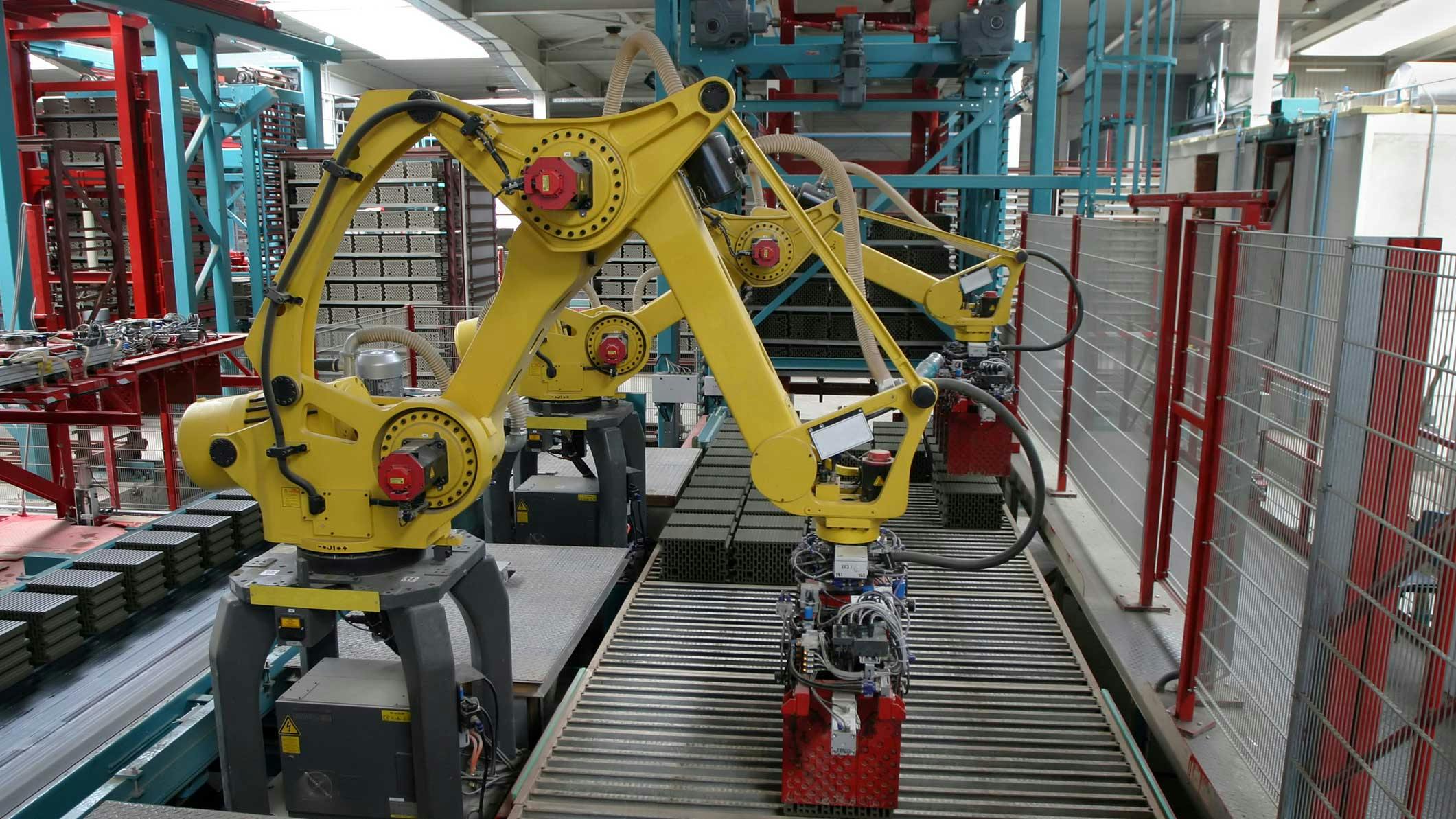 Two industrial robots working along a production line