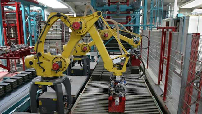 Two industrial robots working along a production line