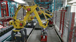 Two industrial robots working along a production line Two industrial robots working along a production line
