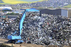 Excavator Working in a Scrap Yard Excavator Working in a Scrap Yard