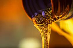 Close up of Oil Pouring Out of a Bottle Close up of Oil Pouring Out of a Bottle