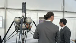 Two men looking at system for Elara Aerospace rocket incorporating Thomson actuators Two men looking at system for Elara Aerospace rocket incorporating Thomson actuators