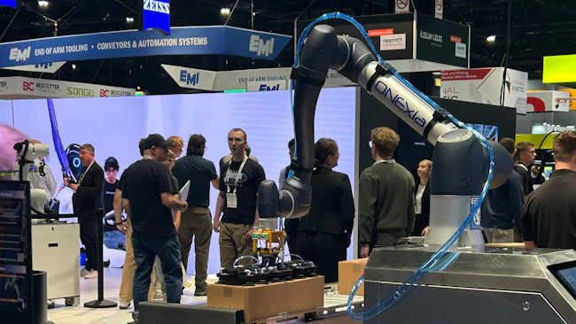 Robot with Pneumatic Lines and Vacuum Gripper on Display at Automate