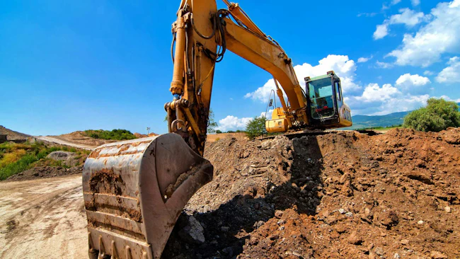 Excavator Digging into Dirt