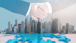 Two hands shaking over puzzle pieces and superimposed over office buildings to provide concept of business mergers and acquisitions