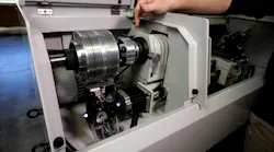 Hand pointing to the Tormach Automatic Collet Closer in a CNC Lathe