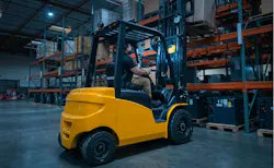 Electric Forklift Working in a Warehouse