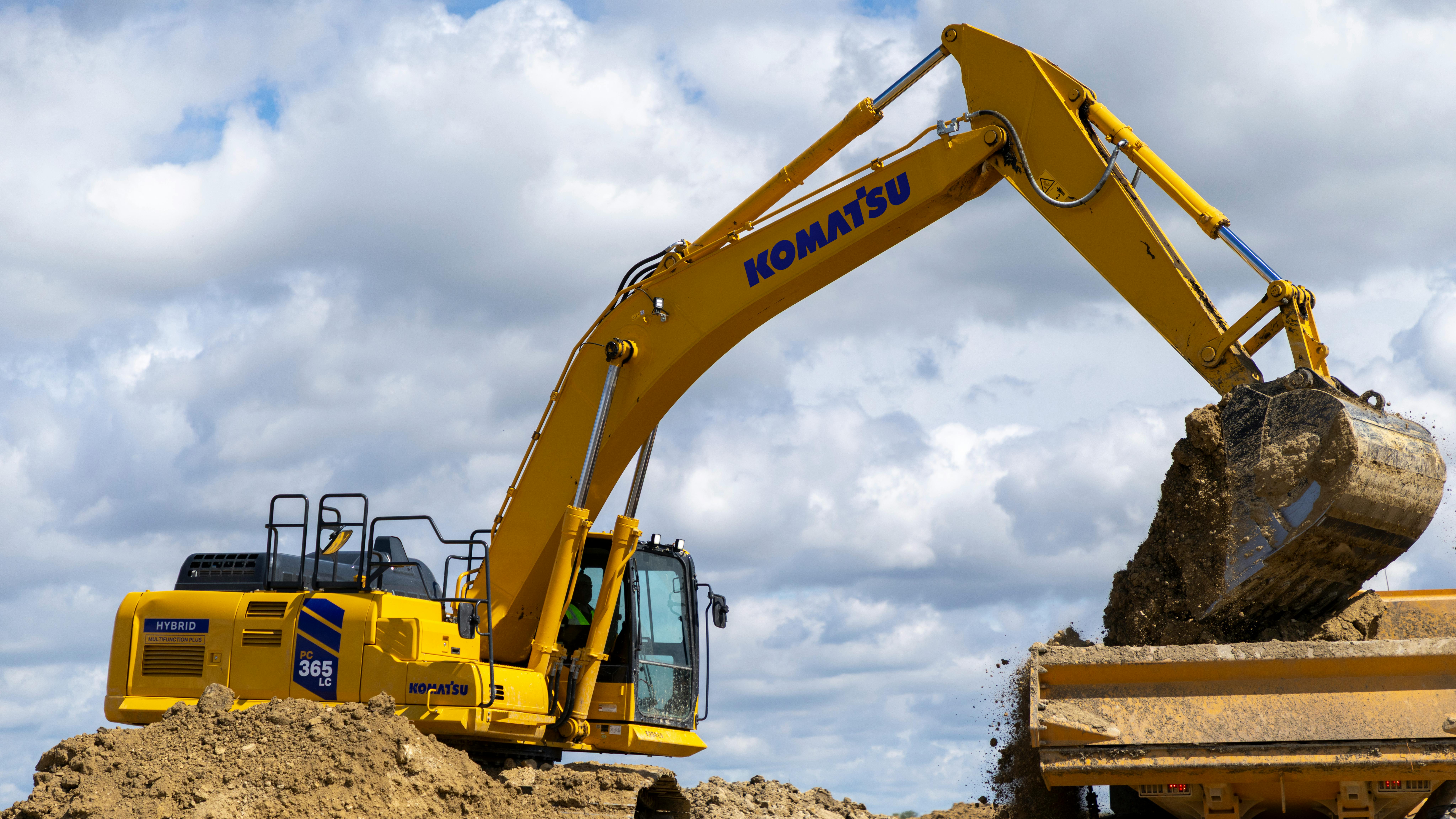 Komatsu PC365LC-11 Excavator Loading Dirt into Truck