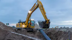 Komatsu PC365LC-11 excavator Working on Job site at dusk
