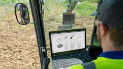 Operator Looking at Machine Data on In-Cab Display