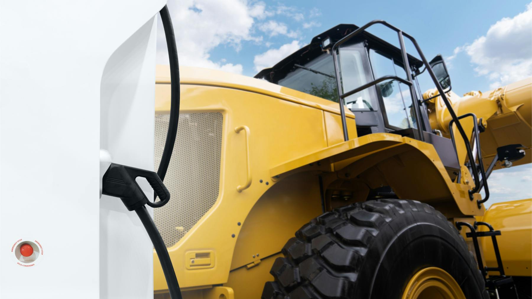 EV Charger next to wheel loader to demonstrate concept of electrification in construction equipment