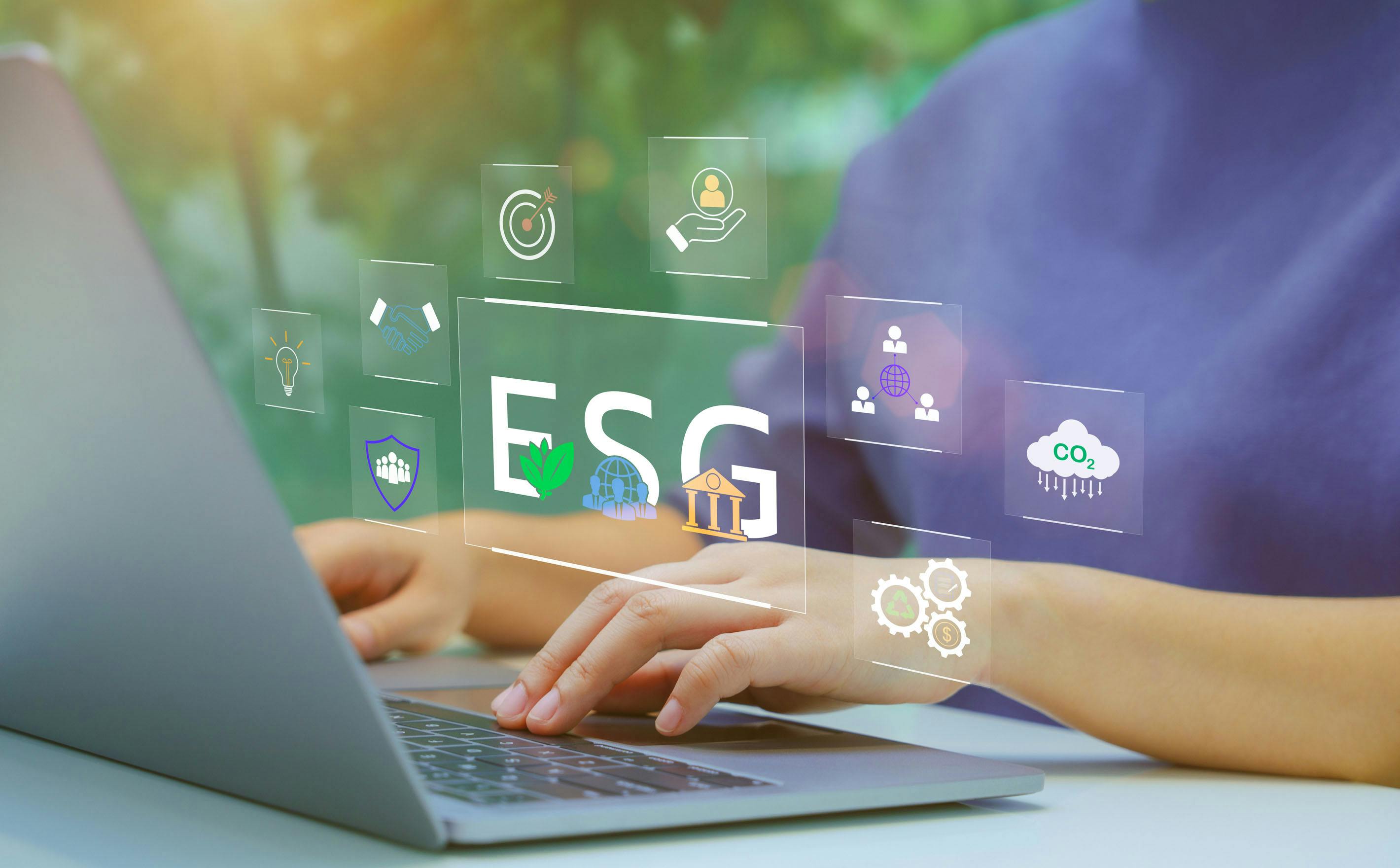 Woman typing on laptop with imagery overlaid to indicate concept of ESG