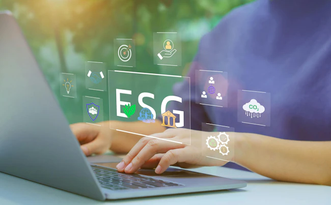 Woman typing on laptop with imagery overlaid to indicate concept of ESG