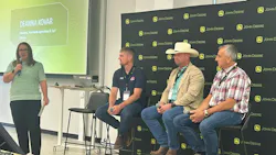 Deanna Kovar from John Deere speaking into microphone and Jack Fehr, Kelly Garrett and Kelley Kokemiller sitting in chairs for a panel discussion