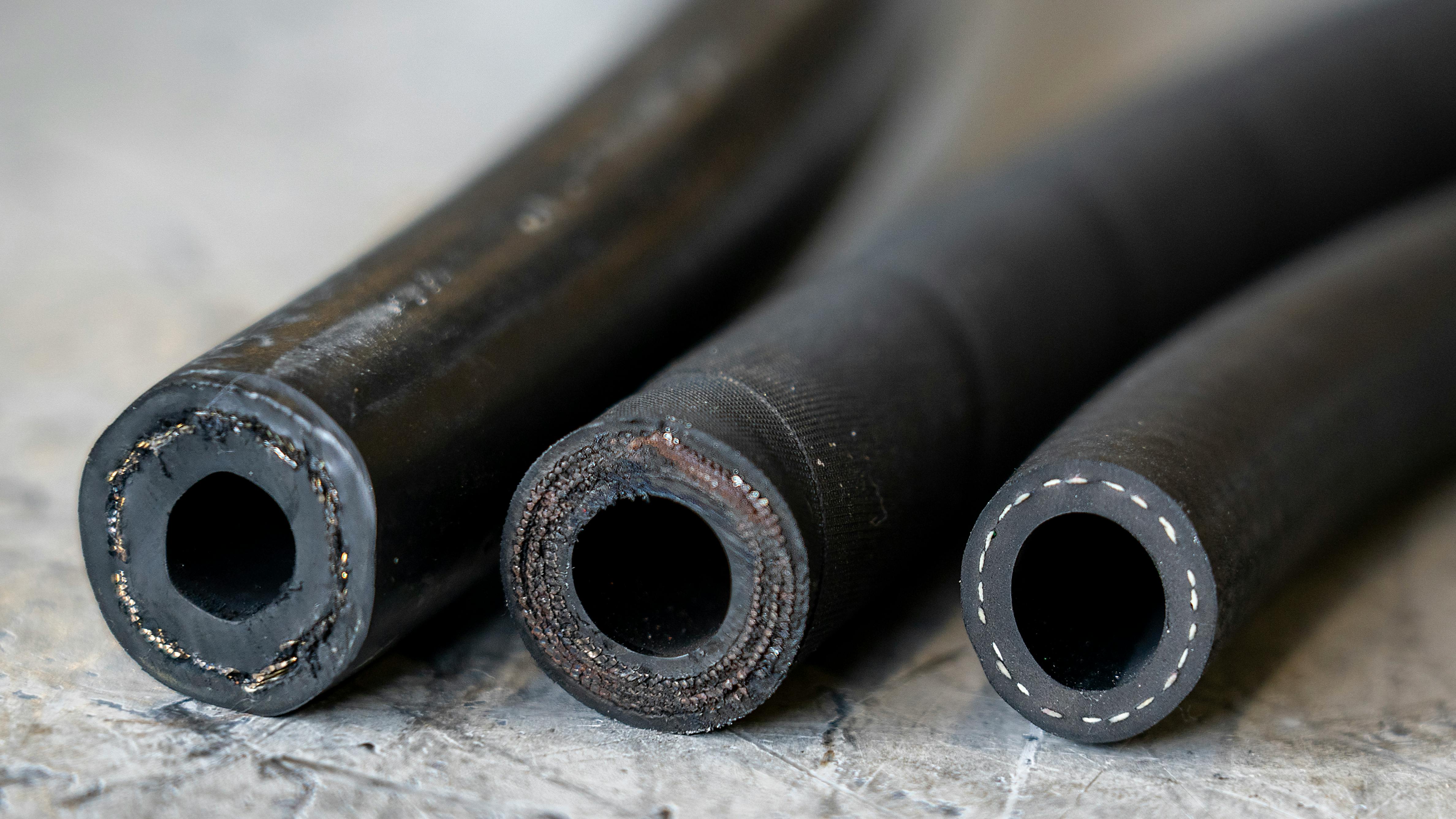 Hydraulic and Industrial hoses lined up in a row