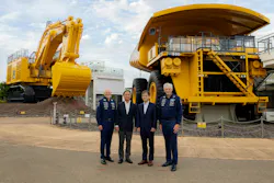 Komatsu and Williams Executives in Front of Komatsu Machines