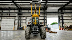 Underside view of wheel loader arm with HKX Auxiliary Hydraulics Kit installed on it