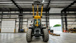 Underside view of wheel loader arm with HKX Auxiliary Hydraulics Kit installed on it