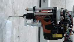 Close up on the Drilling Machine on Schindler Elevator Installation Robot