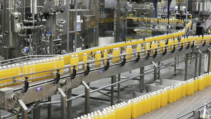 Filled bottles moving down an automated production line