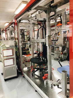 A chair being tested on a test stand